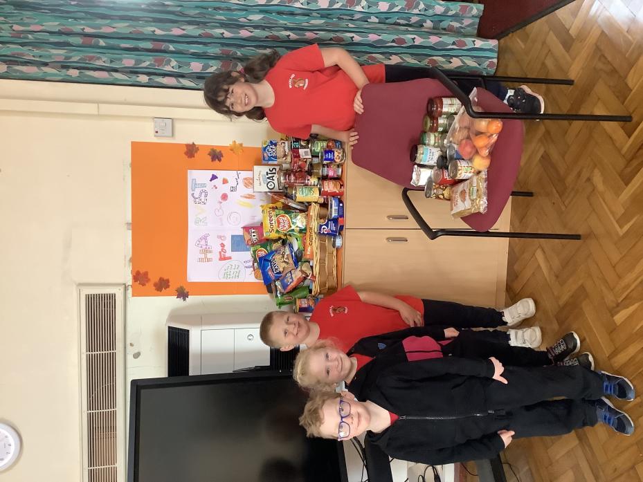 KIND KIDS: Pupils from Woodland School with items donated for the foodbank