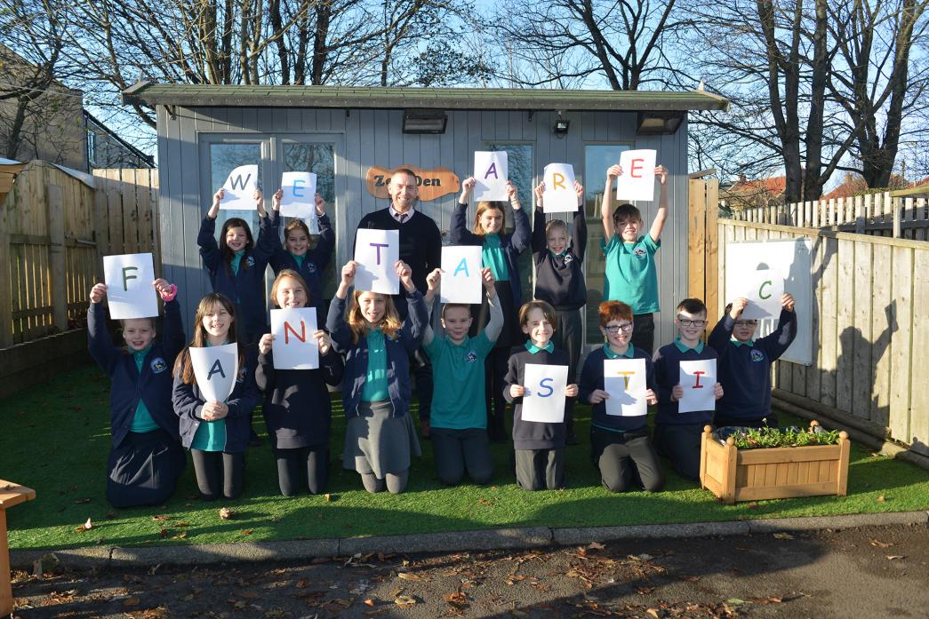TOP MARKS: Head teacher Steve Whelerton and pupils from Staindrop Primary School celebrate being named as top in County Durham and second in the North East in the Parent Power Sunday Times Schools Guide