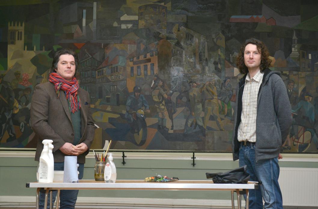 JOB DONE: Luke Jordan and Cedric Charleof completed the restoration of the Pittuck Mural in St Mary’s Parish Hall