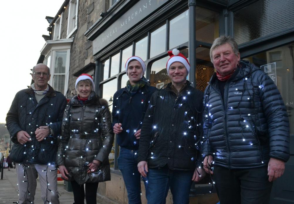 PLANNING AHEAD: Members of the Christmas Lights group with the icicle lights that need replacing, from left, Roger Peat, Jacquie Warner, Charlie Ing, Jonathan Wallis and John White
