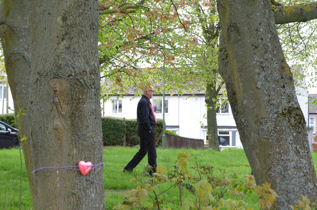 BEDE KIRK BATTLE: County councillors visited the green before the crunch meeting. Protestors had put hearts on the trees they hoped to protect. Pictured is Cllr Charlie Kay, highways committee chairman