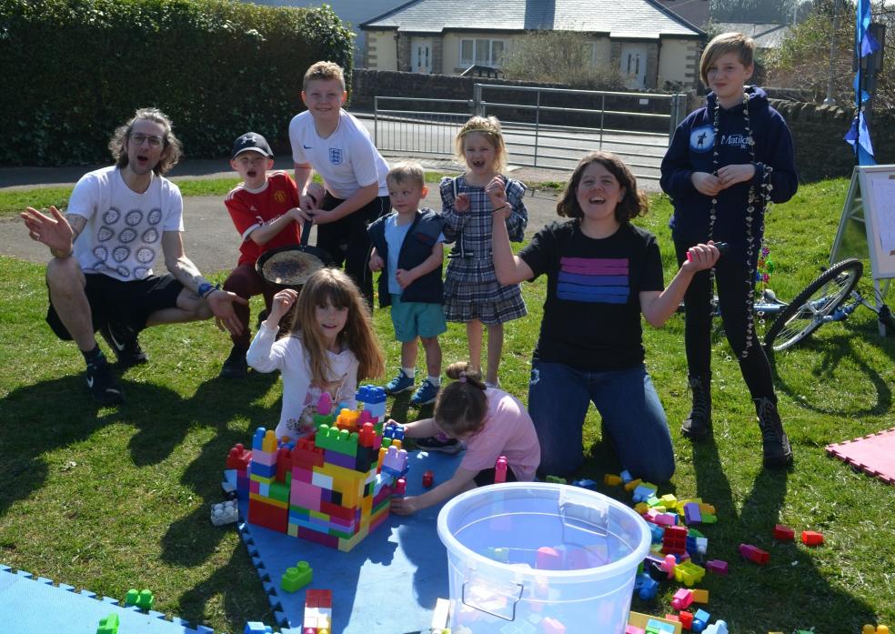 ALL SMILES: Rupert Philbrick and Sarah Gent join in the fun at Dawson Road play area