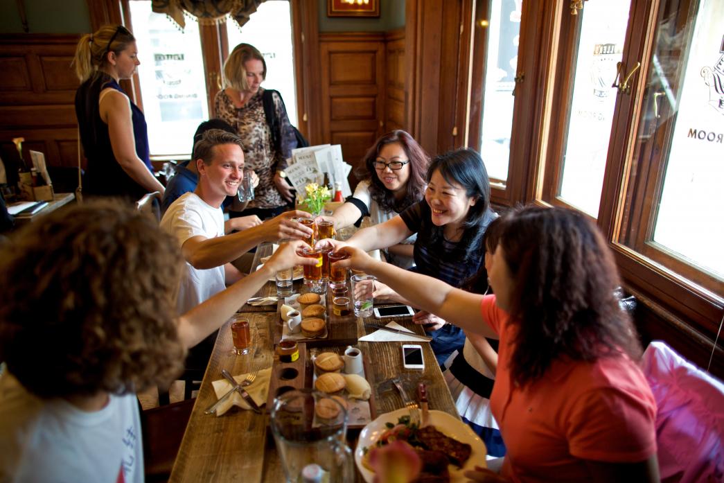 CHEERS! Jay Smith shares the British pub experience with a group of Chinese visitors