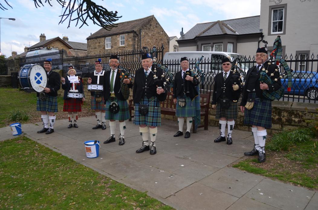 DRUMMING UP SUPPORT: Vintage Pipes and Drums entertained passers-by in Barnard Castle, busking on the Scar Top  	        						          TM pic