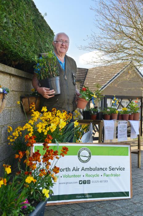 GROWING CASH: Keen gardener Barry Parker has raised more that £100 for the air ambulance service through the plant stand in front of his home in Barnard Castle