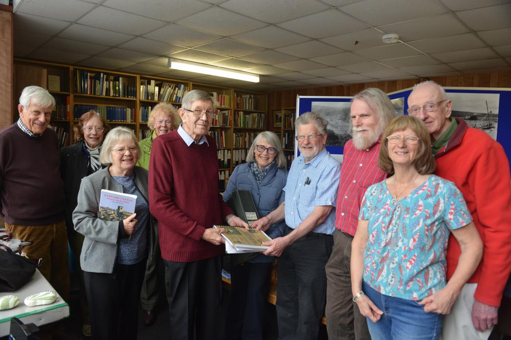 GRATEFULLY RECEIVED: Chairman Bill Bartle and secretary Hazel Yeadon hand over the Barnard Castle History Society’s archive to Fitzhugh Library volunteer Derek Sims while other members of the society and library look on