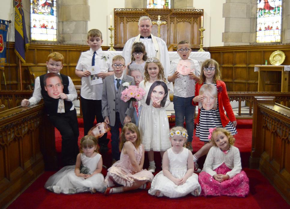 MOCK CEREMONY: Revd Graham Copley with the wedding party which included Thomas, Niall, Nicholas, Lexi, Laura, Thomas, Alisha, Layla, Lily, Amelia and Lily