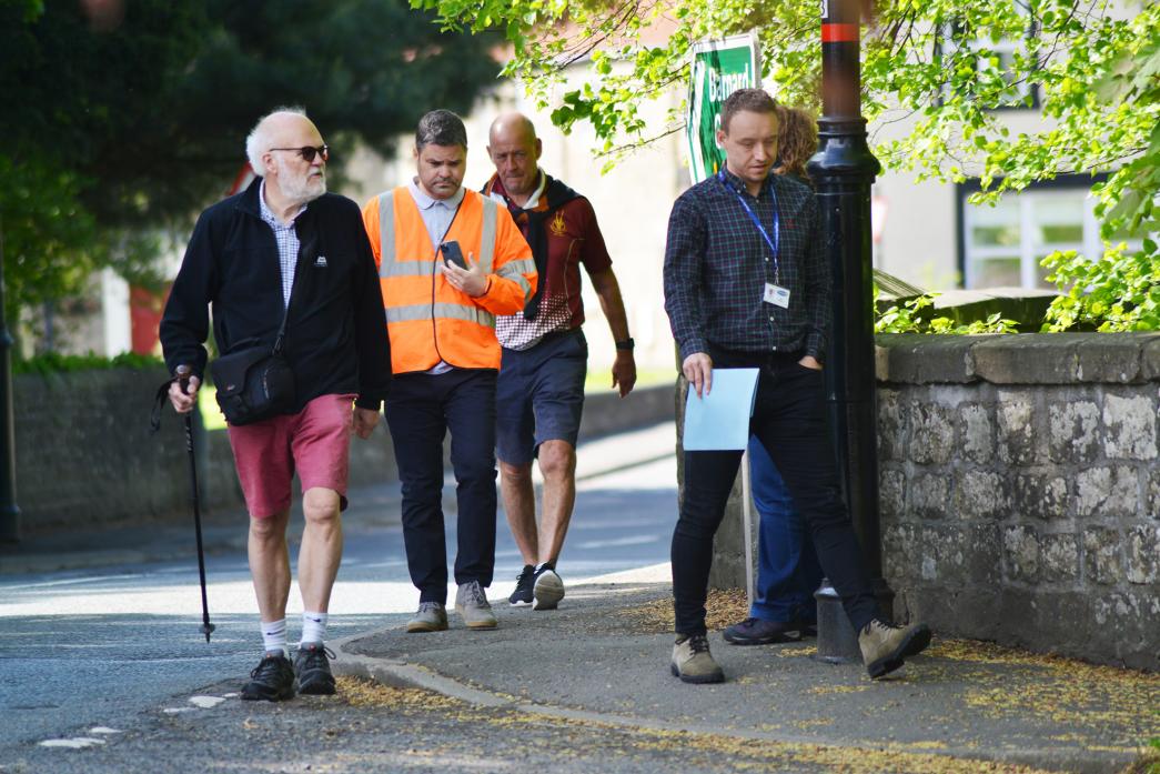 DANGER CLAIMS: Staindrop Parish Council chairman Ian Royston leads county officers on an inspection of the footpath from the village to Raby Castle, which he believes is dangerous for pedestrians and cyclists TM pic