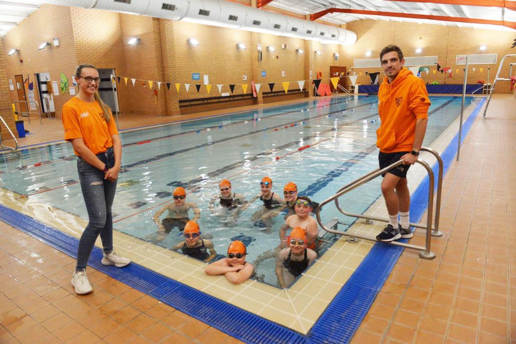 MAKING A SPLASH: Teesdale Tiger Sharks Amateur Swimming Club was awarded £5,000 funding for new starter blocks to allow for more open days and inter-club meets. Coaches Holly Robinson and Aaron North are seen with some of the club’s young swimmers