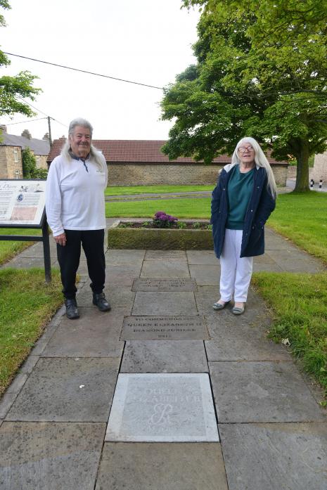 JUBILEE TRIBUTE: Cockfield parish councillors Neville and Brenda Singleton at the newly engraved flagstone which along with three others at the Dixon trough mark four milestone jubilees in the Queen’s reign TM pic