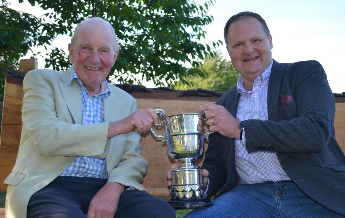 ENDURING EVENT: Richard Mallender, standing, secretary of Cliffe CC, with Richard Wilson and the village cricket trophy founded by his grandfather 100 years ago