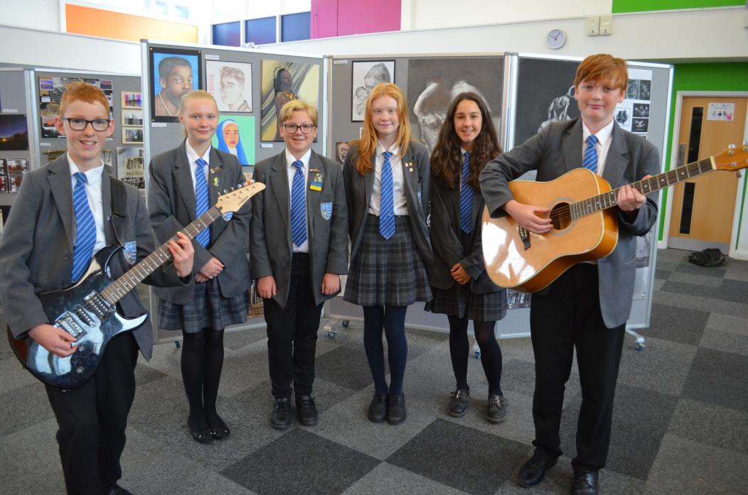 ON SONG: Some of the young musicians who performed at the Summer Celebration, from left, James Williams, Kate White, Owen Usry, Poppy Shield, Penny Williams and Nate Parks. Left, keen photographer Matthew Hendry