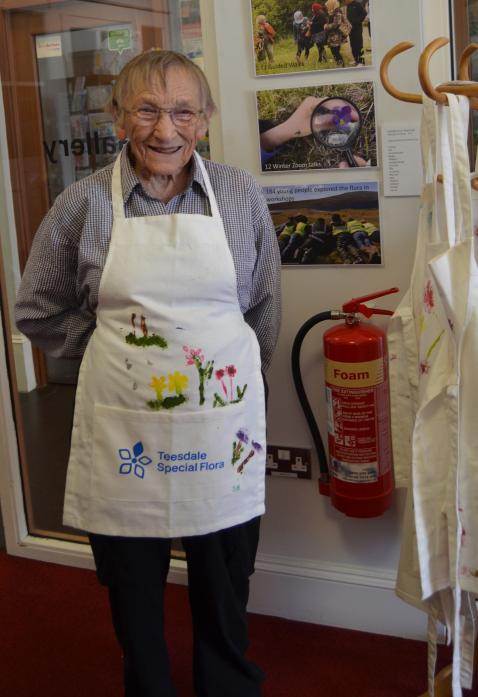 SPREADING THE WORD: Botanist Dr Margaret Bradshaw, founder of the Teesdale Special Flora Research and Conservation Trust, tried on one of the hand-painted aprons created during the project