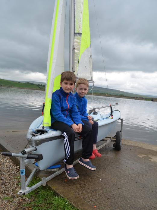 SETTING SAIL: Brothers Max, 9, and Rory Yeowart, 7, on one of the sailing club’s RS Feva sailing dinghies bought with cash from Teesdale Action Partnership