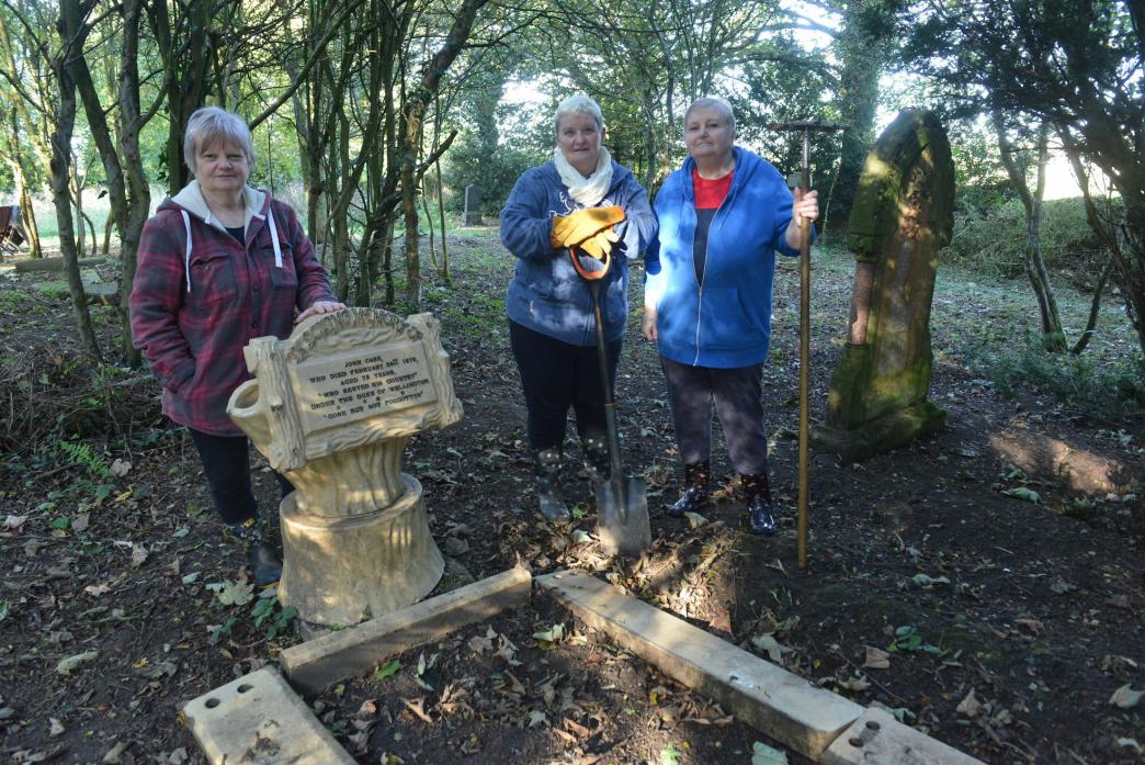 HISTORIC FIND: Aline Waites with sisters Dawn Fox and Joy Gallimore restored the grave of John Case who served under the Duke of Wellington  				              TM pic