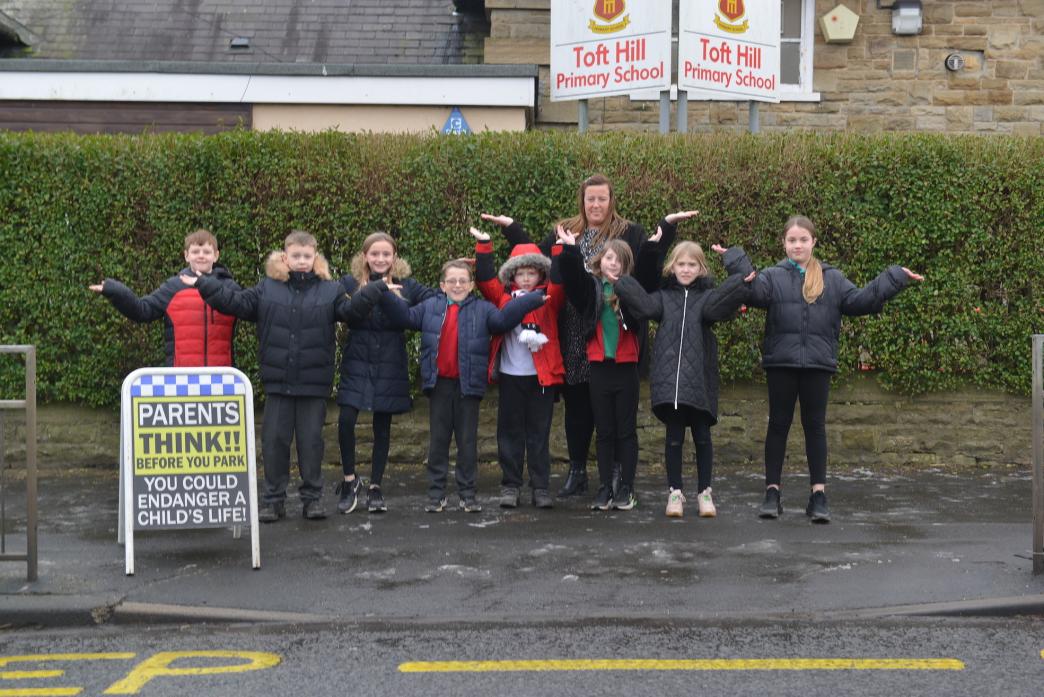 AT A LOSS: Headteacher Leanne Nesbitt and pupils from Toft Hill School are worried about safety as they struggle to find someone to run the crossing patrol on the busy A68       TM pic