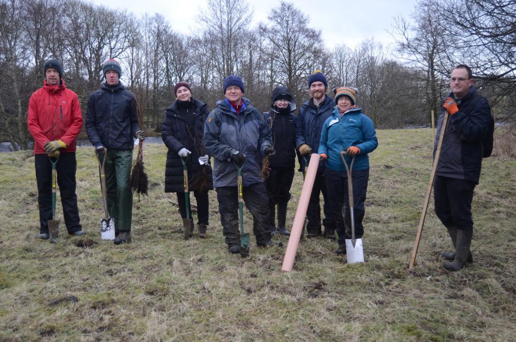Milestone moment: A group of volunteers and staff from the North Pennines National Landscape Tees Swale Naturally Connected scheme gather to plant about 100 whips – young saplings – of native species. Mark Windle, centre, planted the first tree