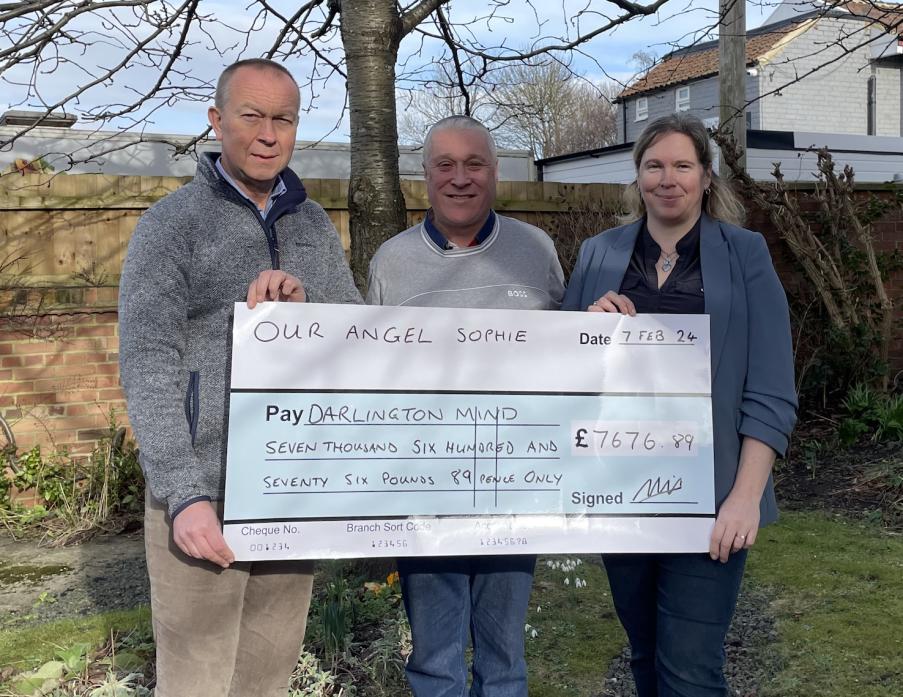 FOR SOPHIE: Marcus Hawthorn, from the Mind charity, in Darlington, accepts a cheque from Charles and Lindsey Hall who lost their daughter Sophie to suicide