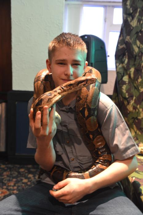 IN DEMAND: Leon Horrocks with his pet boa constrictor Ivy during a show at Woodland’s Edge Hotel earlier this month  							             TM pic