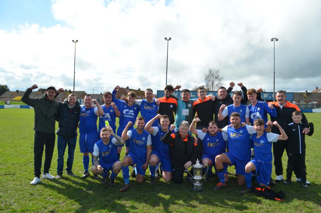 JUBILANT: Evenwood Town FC with the Norman Wright Memorial Trophy
