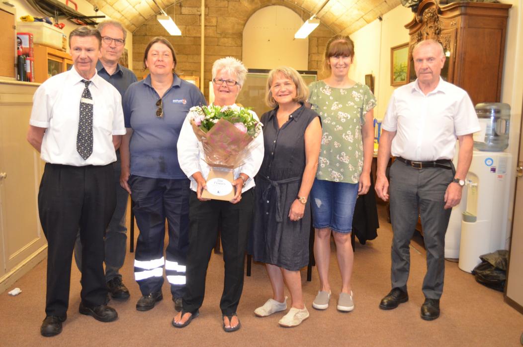FAREWELL: Bowes Museum attendant Pat Samson  was presented with flowers to mark her retirement. She is pictured with colleagues Dave Richardson, Jon Old, Val Cockfield, Joanna Hashagen, Jean Dempster and Kevin Hazelton
