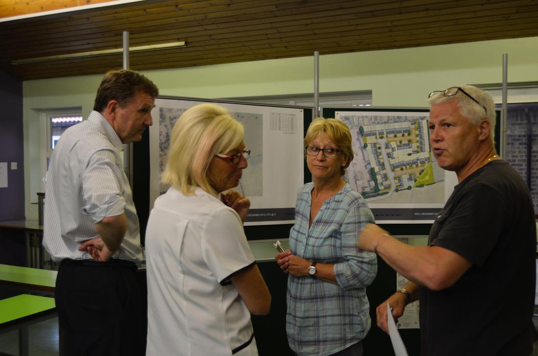 VILLAGE MEETING: Planning consultant Ian Lyle, left, talks through the development proposals with residents