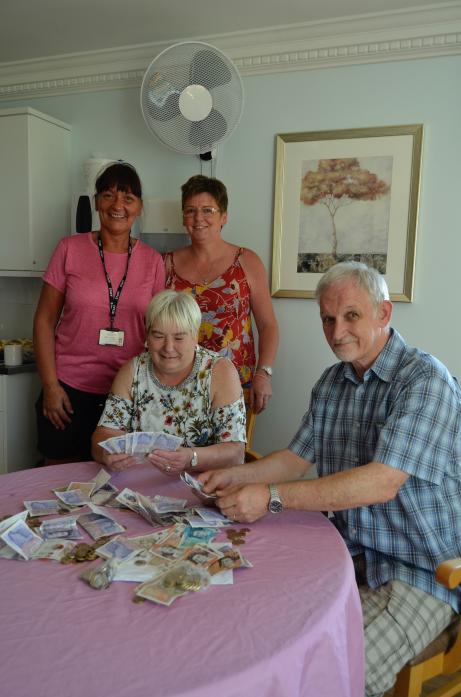 GENEROUS VILLAGE: Fundraisers, from left, Judith Buckle, Alison Stoker, Sharon Elliott-Kemp and Sandy Gall count the donations