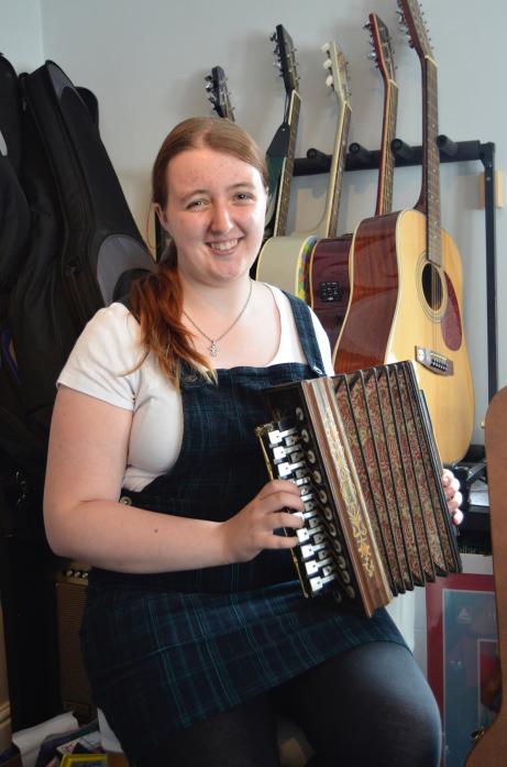 AWARD WINNER: Diana Award winner Heather McLachlan with the antique Flutina she has taught herself to play as part of Cream Tees